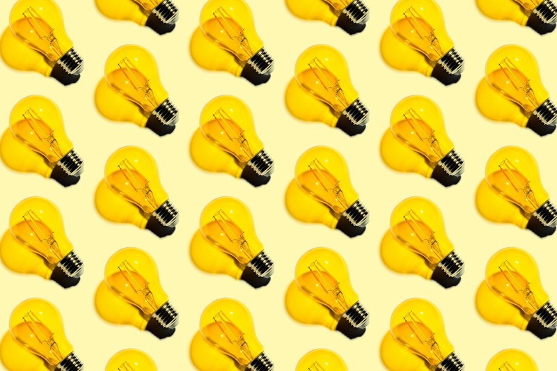 Yellow light bulbs repeating pattern