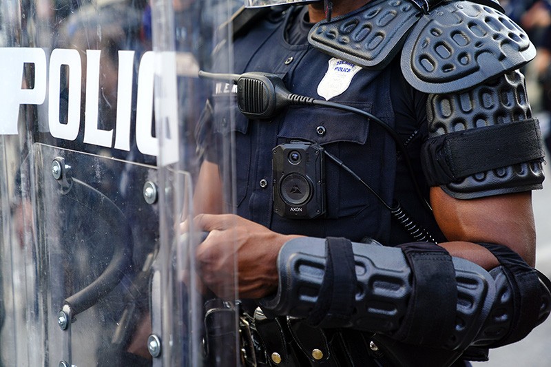 A police officer wearing a body cam and riot gear in Atlanta