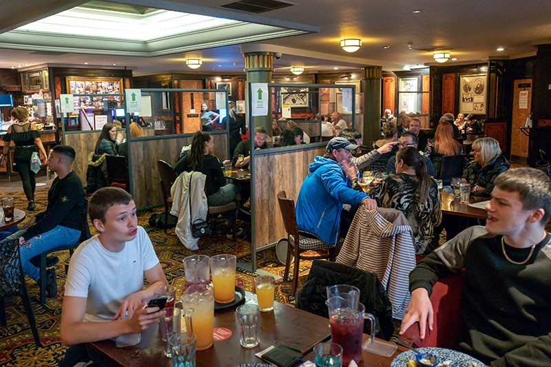 General view as customers return to the Regal Moon JD Wetherspoons pub in Rochdale, England.