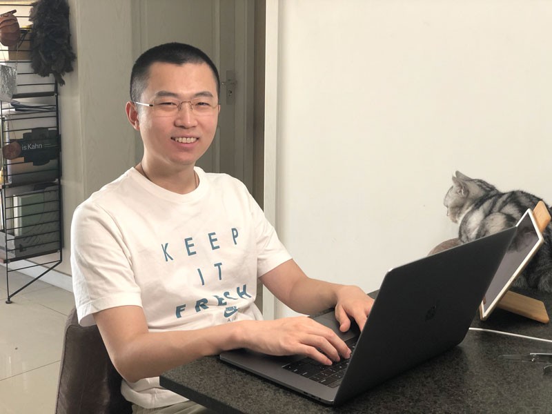Chenyang Li sits behind a computer