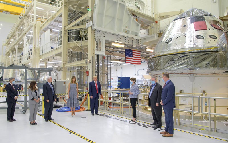 President Donald Trump views the Artemis II space capsule