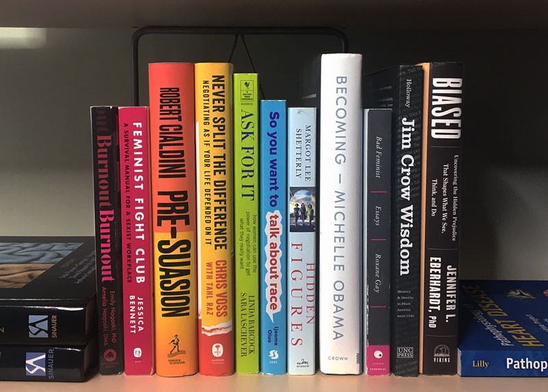 Books about diversity and inclusion on a bookshelf