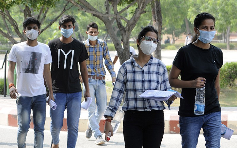 Candidates arrives to appear for semester exams held by Abdul Kalam Technical University (AKTU), Noida, India.