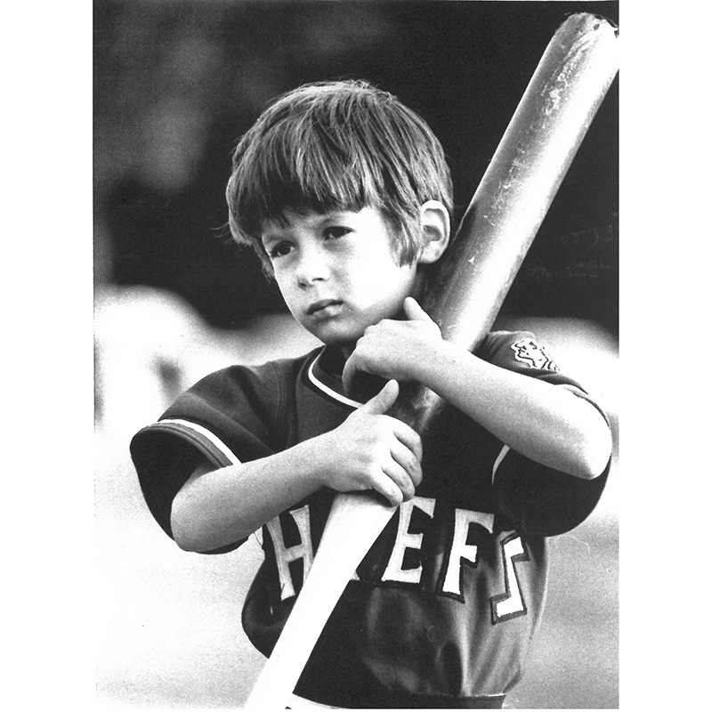 Joey O’Donnell holding a baseball bat and wearing a team jersey.