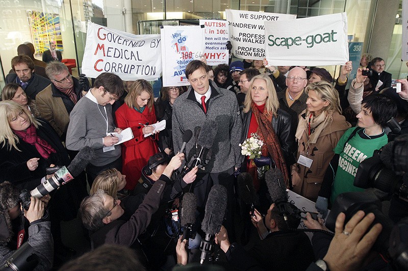 British Doctor Andrew Wakefield (C) stands with his wife Carmel as he addresses the media.