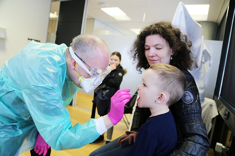 A family gets tested for COVID-19 at deCODE’s testing facility in Reykjavik, Iceland