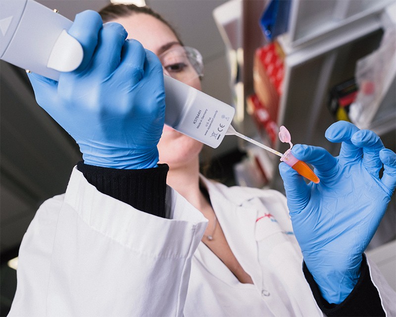 Photo of a lab technician at De ep Genomics in Canada, where AI is used in drug development.