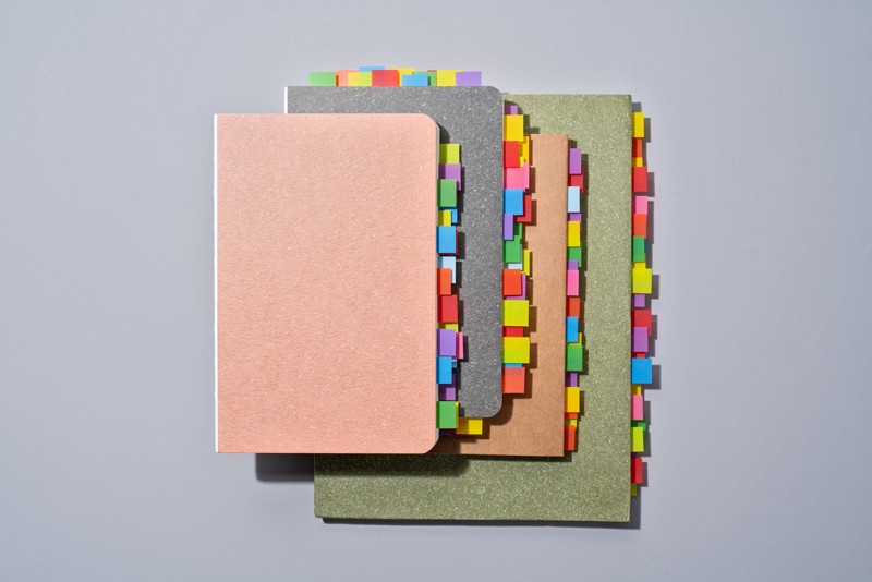 Colourful bookmarks on note pads