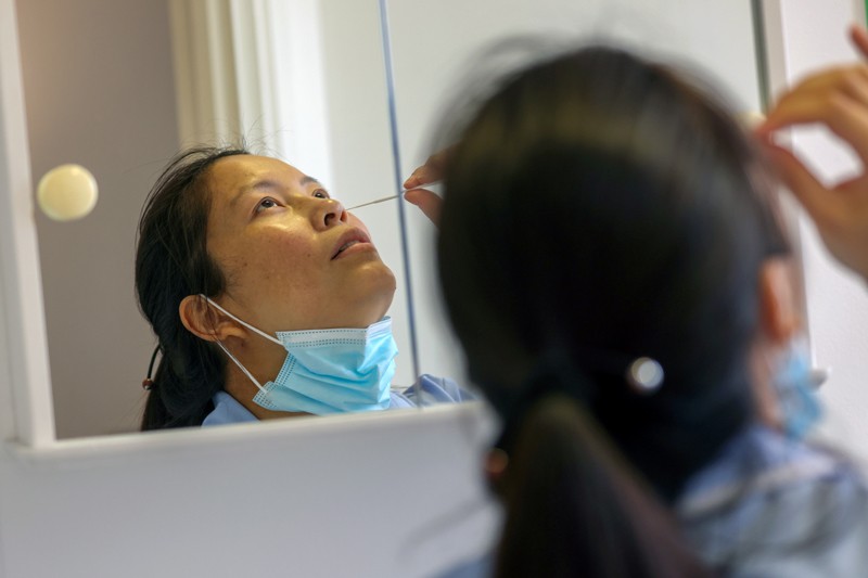 Care assistant self-administers a rapid coronavirus test