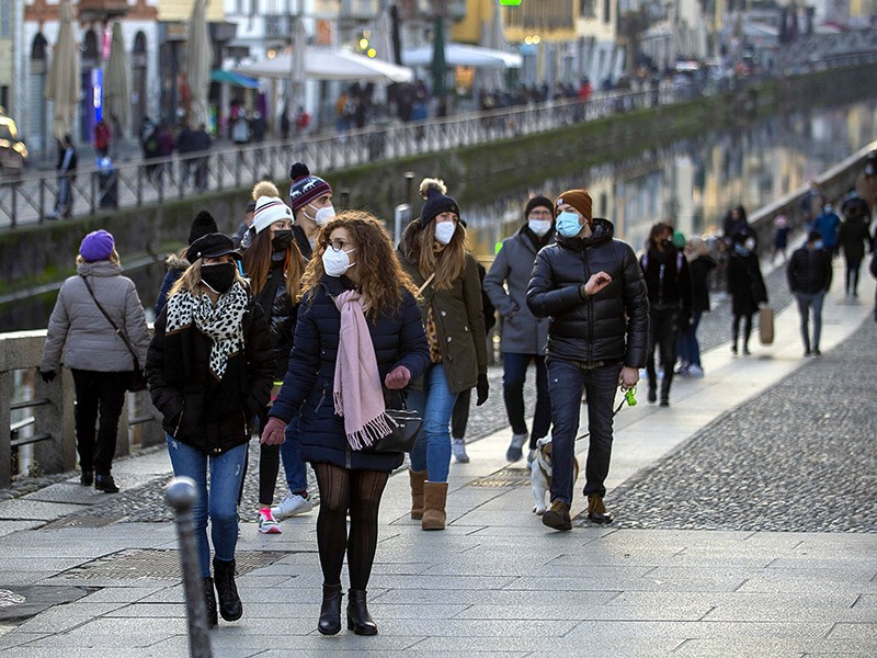 Crowds stroll along the Navigli and the Darsena during coronavirus pandemic restrictions, in Milan, Italy.