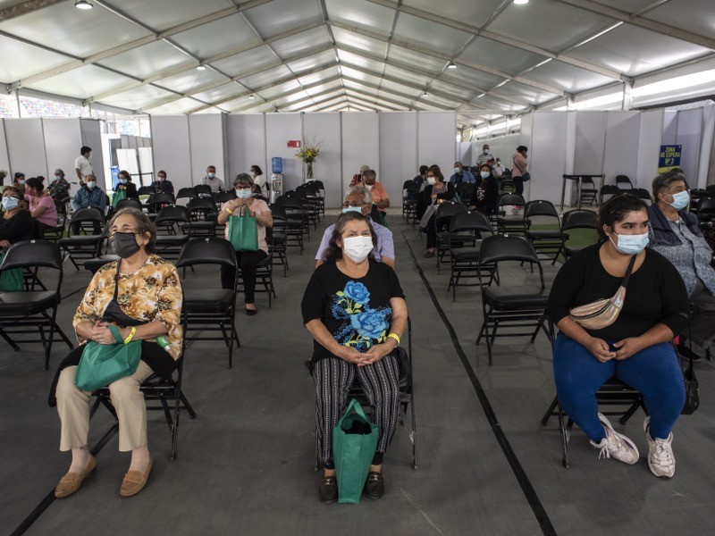 Senior citizens wait for their COVID-19 vaccine at Estadio Bicentenario La Florida, on February 12, 2021 in Santiago, Chile.