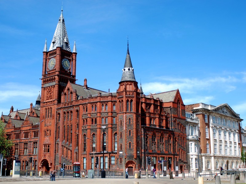 A large brick building with a clocktower