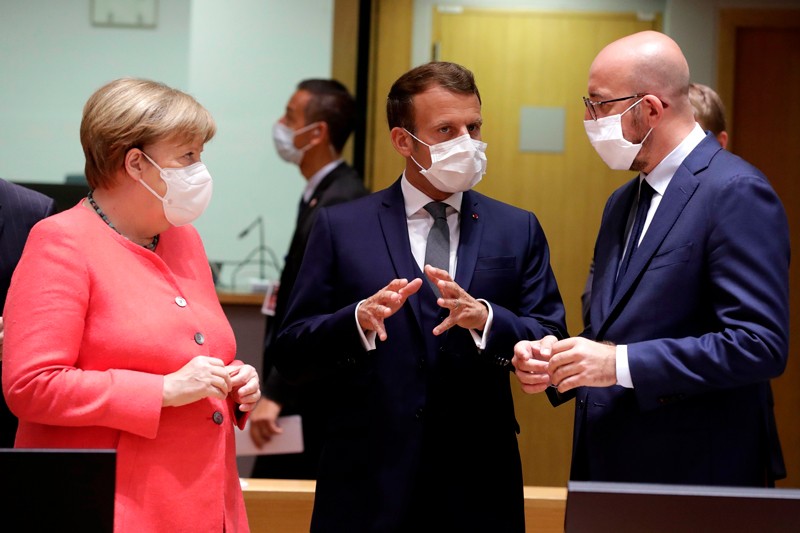 Angela Merkel, Emmanuel Macron and Charles Michel talking