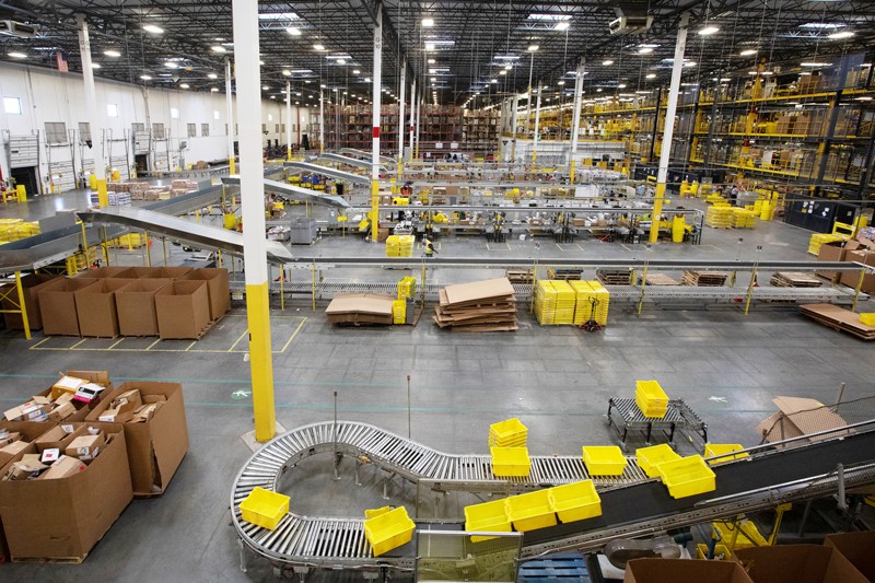 Plastic crates move along a conveyor at the Amazon.com fulfilment centre in Robbinsville, New Jersey