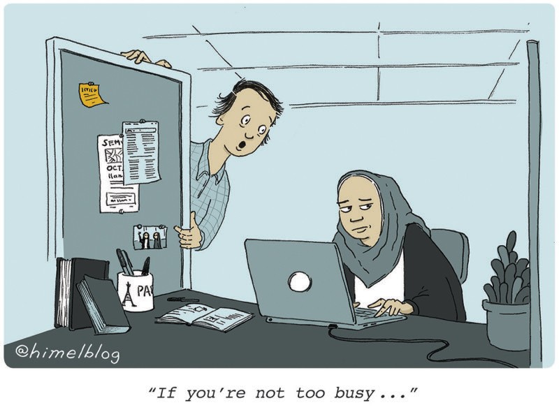 Cartoon: One person leans into another's office cubicle. Caption: "If you're not too busy ..."