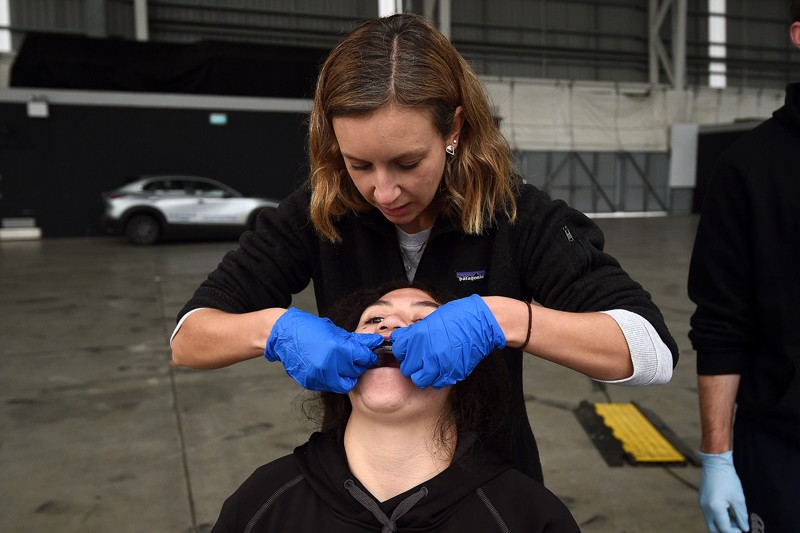 A female rugby player has a biometrics mouthguard fitted for a head impact study at Forsyth Barr Stadium, New Zealand