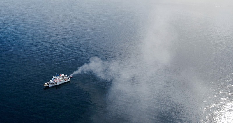 A plume from a boat spraying seawater over the Great Barrier Reef in Australia during a 2021 trial.