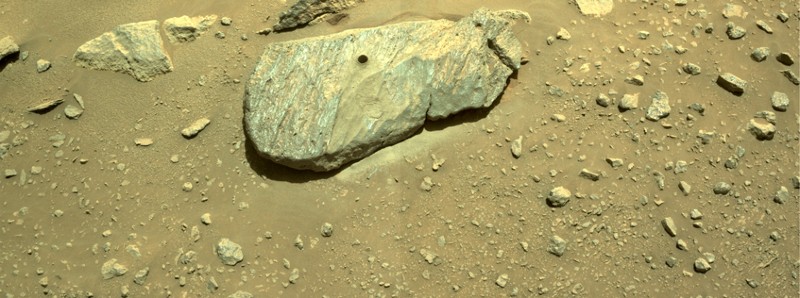 Composite image of rock with drilled hole.