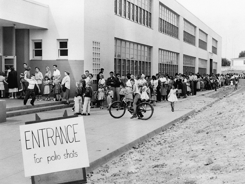 First and second graders at the Kit Carson School here line up for Salk Polio vaccine shots April 16th.