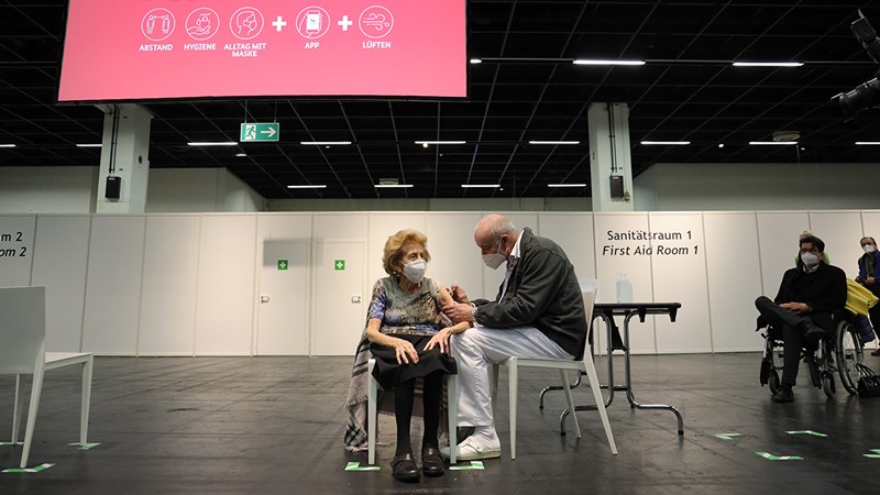 Senior citizen Elisabeth Steubesand, 105, receives an inoculation against COVID-19 at a vaccine center, Germany.