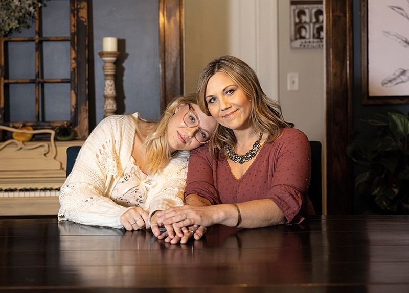 Melissa Cook sits with her daughter Ella Chmielewski