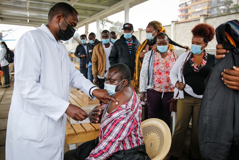 People queue up to receive COVID-19 vaccination in Kenya