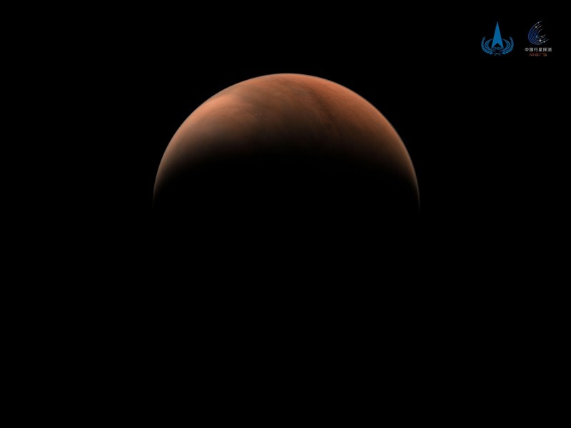 Red planet against a black background.