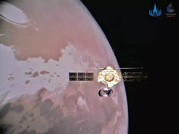 Tianwen-1 pictured in front of the Northern Pole of Mars.