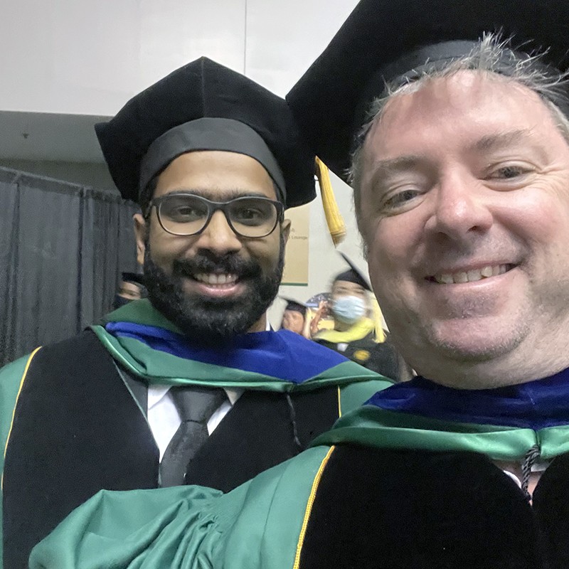 Roger Tipton with his lab friend Abhijit Iver, on their graduation day in December 2021.