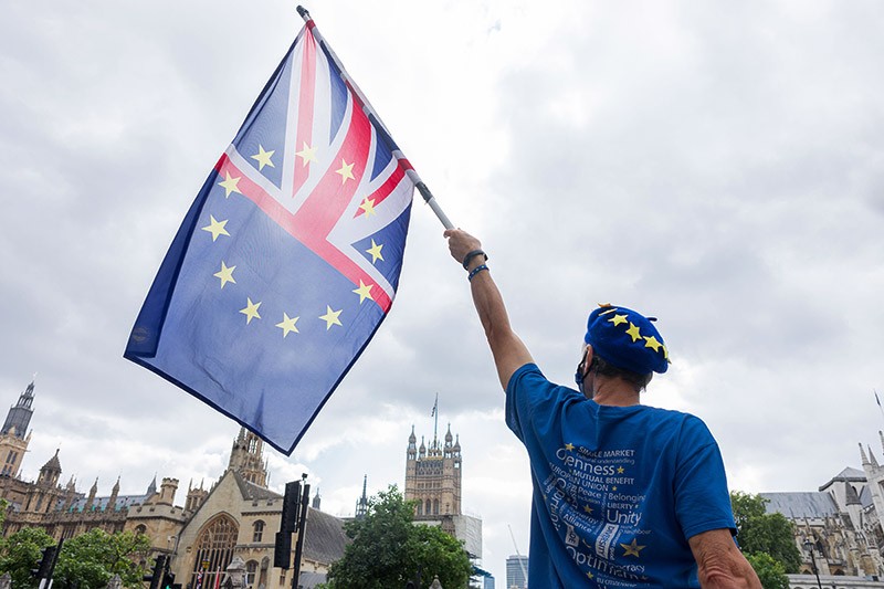 A protestor seen waving the combined EU and UK Union Jack flag in Westminster.