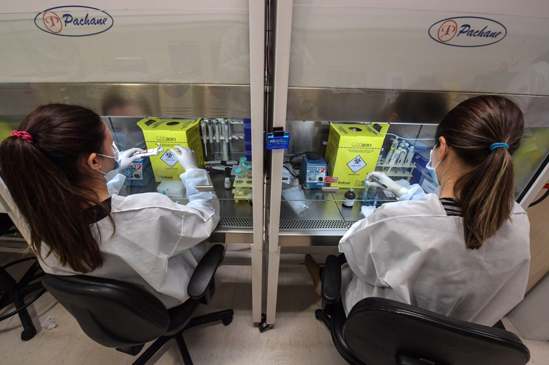 Two researchers work at the special techniques laboratory in Sao Paulo, Brazil