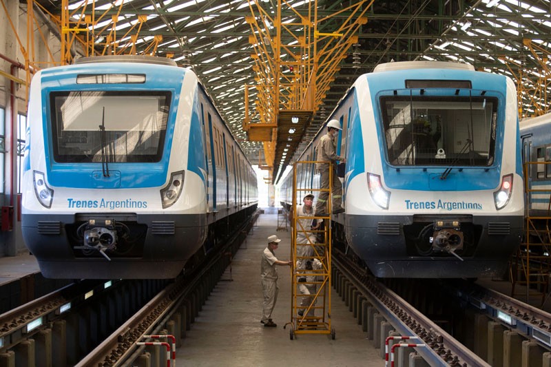 Chinese engineers and technicians inspect a train in Llavallol, Argentina