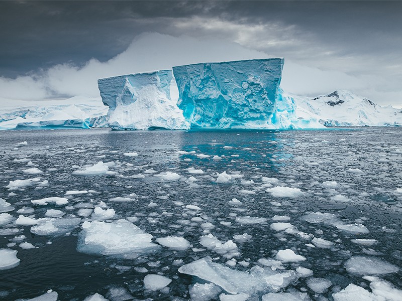 Iceberg sits still on a calm day in Antarctica.