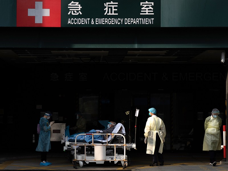 A patient at an entrance to the emergency department at Caritas Medical Center in Hong Kong, China.
