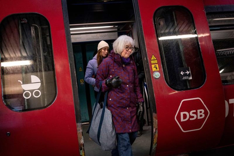 Commuters getting off a train at the Noerreport metrostation in Copenhagen
