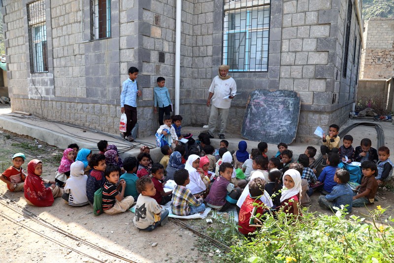 Yemeni school children attending an open-air class