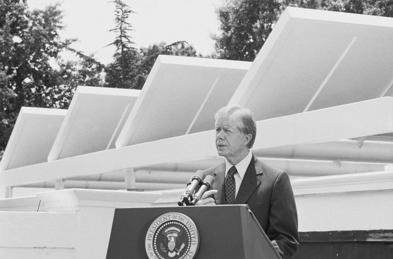 President Carter speaks in front of newly installed solar panels