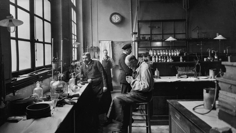 General view of men working in a science lab, circa 1890