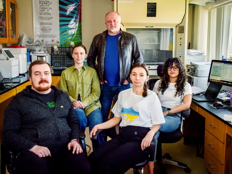 Portrait of Taras Oleksyk with his lab group at Oakland University in Oakland, Michigan.
