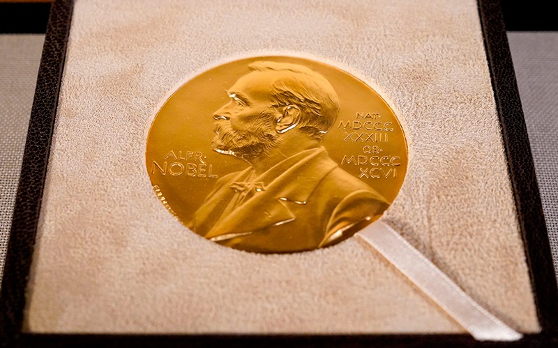 The Nobel prize medal, presented to Charles M. Rice in Physiology or Medicine.