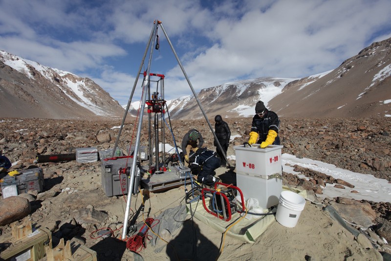 Researchers use a drill to extract an ice core from the Ong Valley in Antarctica