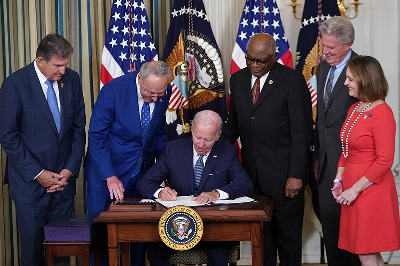 U.S. President Joe Biden signs the Inflation Reduction Act of 2022 into law during a ceremony at the White House.