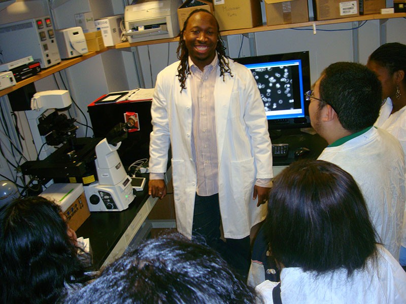 Manu Platt is photographed standing in the laboratory