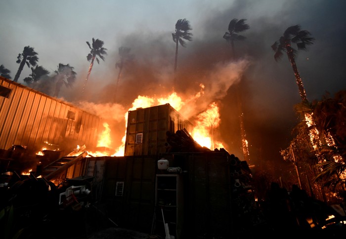 A home engulfed in fire in California