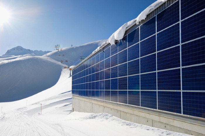 Solar Panels High On Snowy Mountains Yield Peak Power