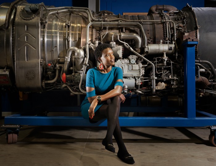 Gladys Ngetich photographed in front of a Concord engine at the Thermofluidics unit at the University of Oxford, UK.