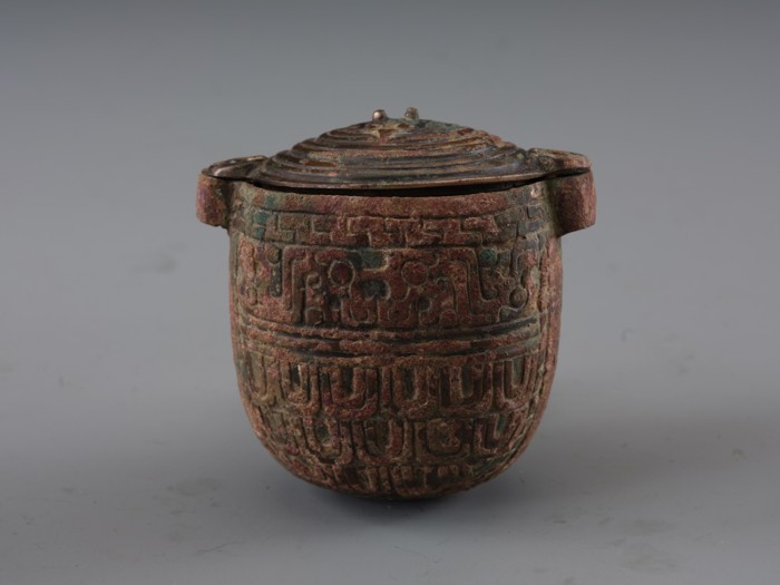The decoration on the bronze jar after cleaning