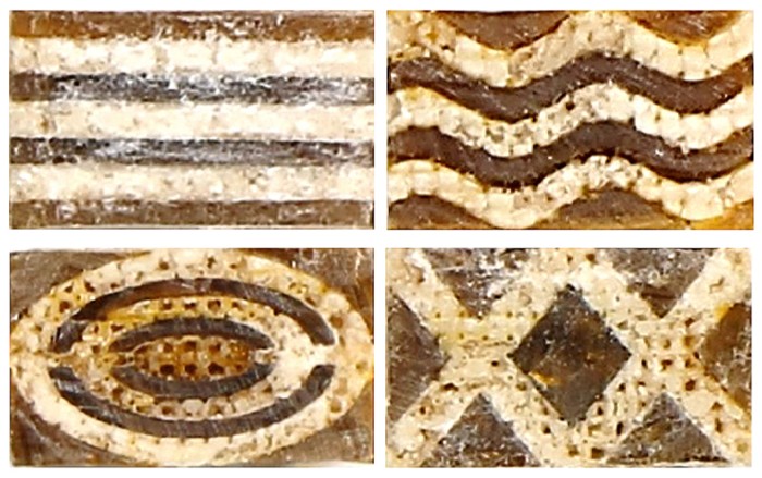 Four pieces of a material made of brown polymer and white calcium carbonate, in various patterns.