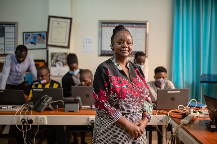 Dorothy Okello with her students learning STEM projects on computers