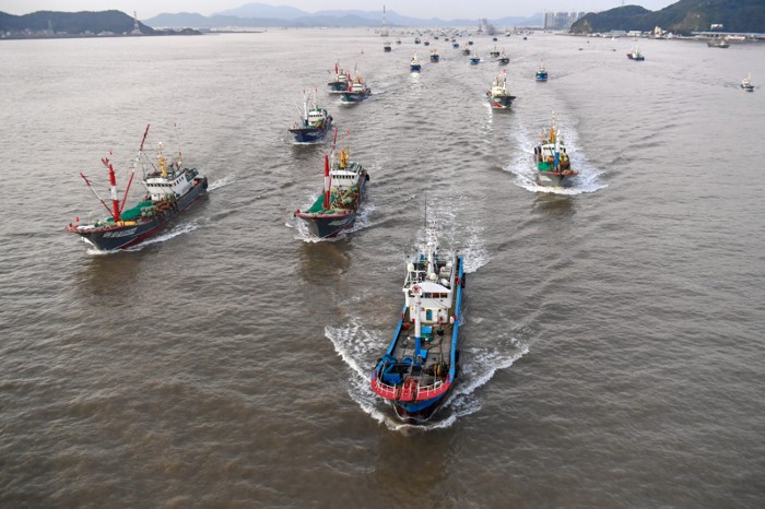 Aerial view of fishing boats setting sail in China.
